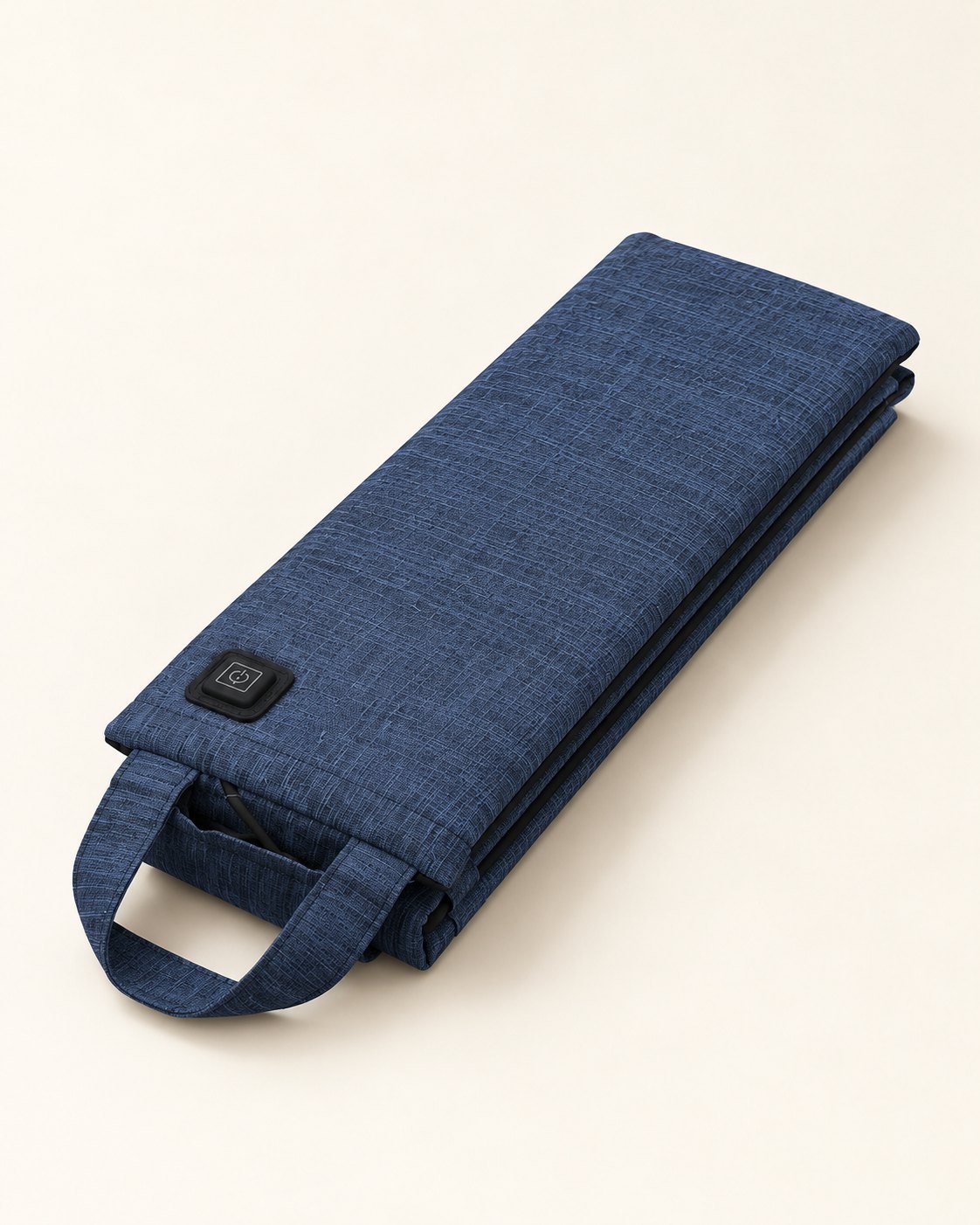 The navy HeatSeat folded into a narrow shape with its carry handle